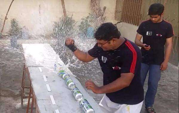 Pakistani Man Crushes World Record 29 Drink Cans While Holding A Raw Egg