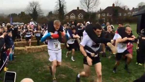 UK Wife Carrying Champ Beats The Mud To Win Place In World Final
